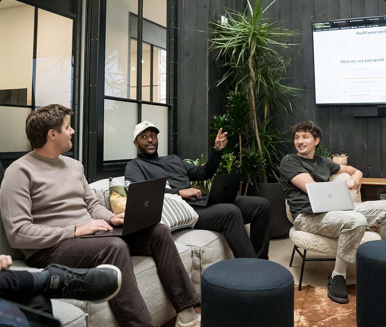 Scroll team members working together in the office